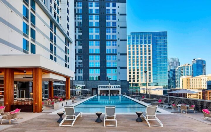 Heated outdoor pool deck and cabanas at AC Hotel Nashville Downtown in SoBro
