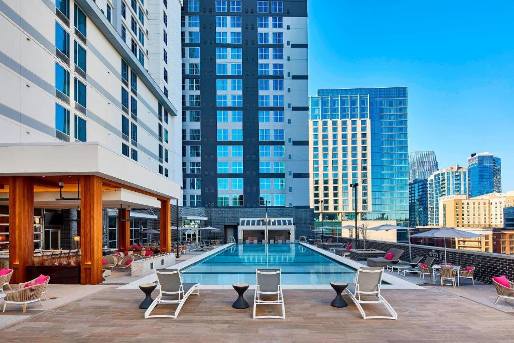 Heated outdoor pool deck and cabanas at AC Hotel Nashville Downtown in SoBro