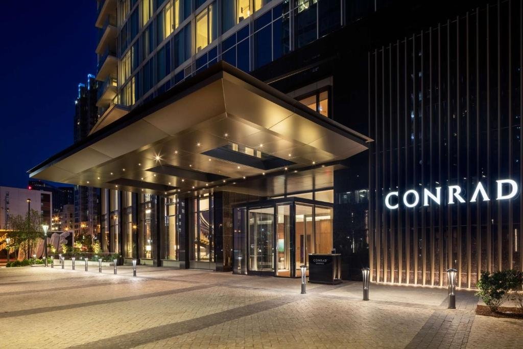 Heated outdoor pool terrace and cabanas at Conrad Nashville in Midtown