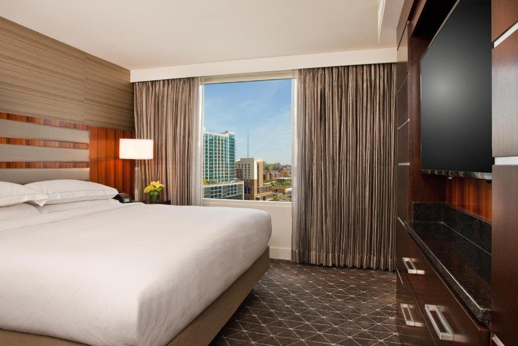 Two-room suite with separate living area and bedroom at Hilton Nashville Downtown