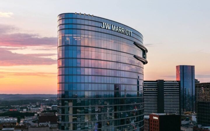 Curved glass exterior and rooftop pool deck of JW Marriott Nashville in SoBro