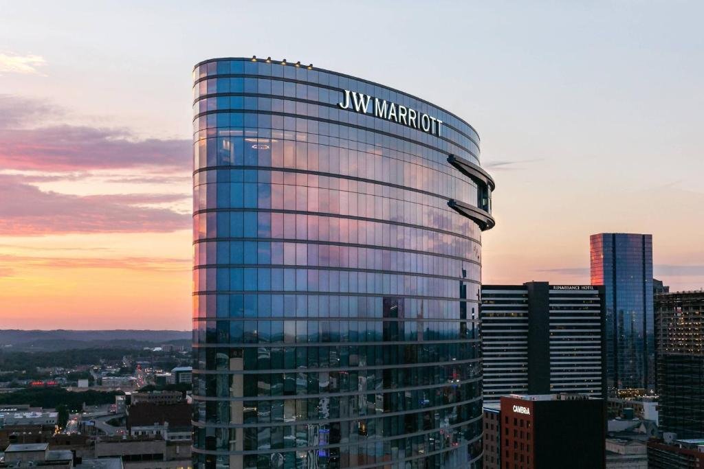 Curved glass exterior and rooftop pool deck of JW Marriott Nashville in SoBro
