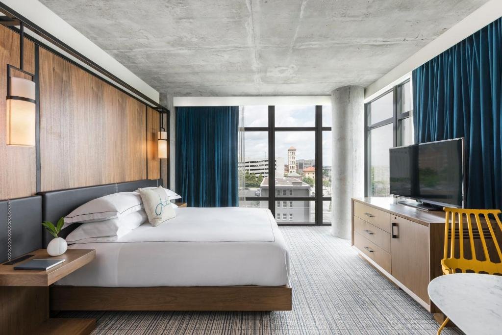Industrial-chic boutique guest room at Kimpton Aertson Hotel Nashville