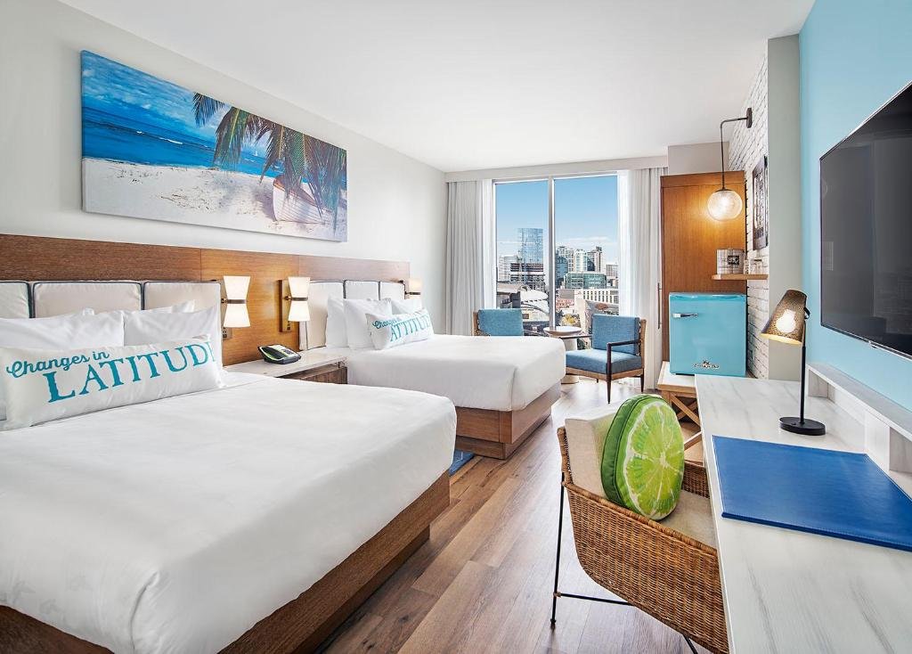 Heated rooftop pool and Fins Bar overlooking SoBro at Margaritaville Hotel Nashville