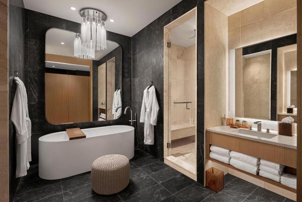 Refined Luxury Collection guest room with custom leather accents at The Joseph Nashville